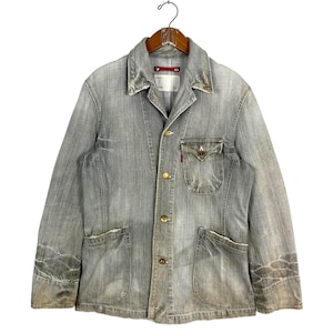 May include: A white ceramic mug with a black handle and the text "But First, Coffee" in a black, handwritten-style font. The mug is on a white surface.