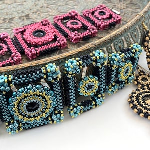 May include: A set of beaded jewelry featuring a necklace and earrings. The necklace is made of black, blue, and gold beads and has a geometric design. The earrings are made of black and gold beads and have a circular design.