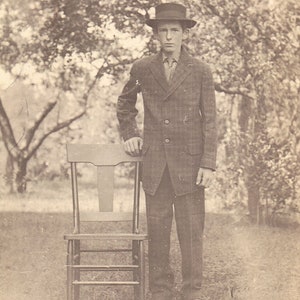 RPPC - Young Man Standing By A Chair