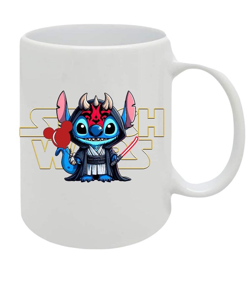 May include: White ceramic mug featuring a cartoon character in a black hooded robe, holding a red lightsaber and a red heart-shaped balloon. The mug has the words "Star Wars" in gold lettering.