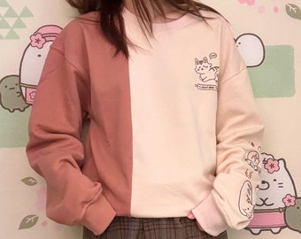 Suéter com bloco de cores bordado com estampa de pão de gato