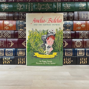 Amelia Bedelia por Peggy Parish, primera edición y primera impresión con sobrecubierta original, ilustrado en color por Fritz Siebel