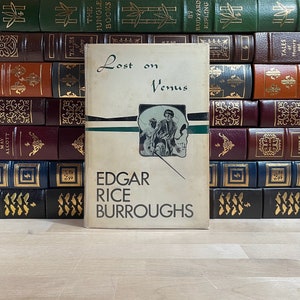 Wydanie Canaveral Press z 1963 r. książki Lost on Venus autorstwa Edgara Rice’a Burroughsa, autora Tarzana i Johna Cartera
