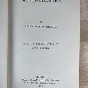 May include: Open book page with the title "MISCELLANIES" by Ralph Waldo Emerson. Includes the text "WITH AN INTRODUCTION BY JOHN MORLEY" and publisher information from London and New York, dated 1905. The words "All rights reserved" are also visible.