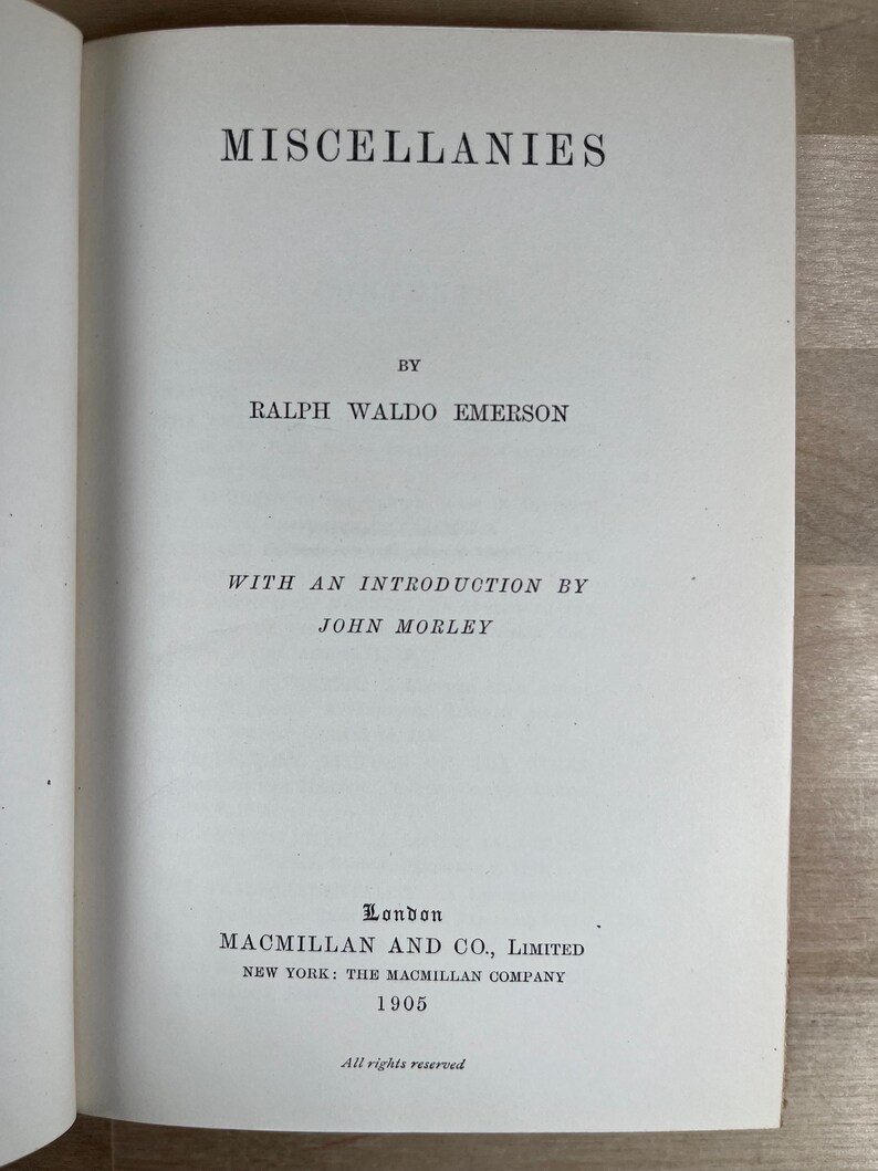 May include: Open book page with the title "MISCELLANIES" by Ralph Waldo Emerson. Includes the text "WITH AN INTRODUCTION BY JOHN MORLEY" and publisher information from London and New York, dated 1905. The words "All rights reserved" are also visible.