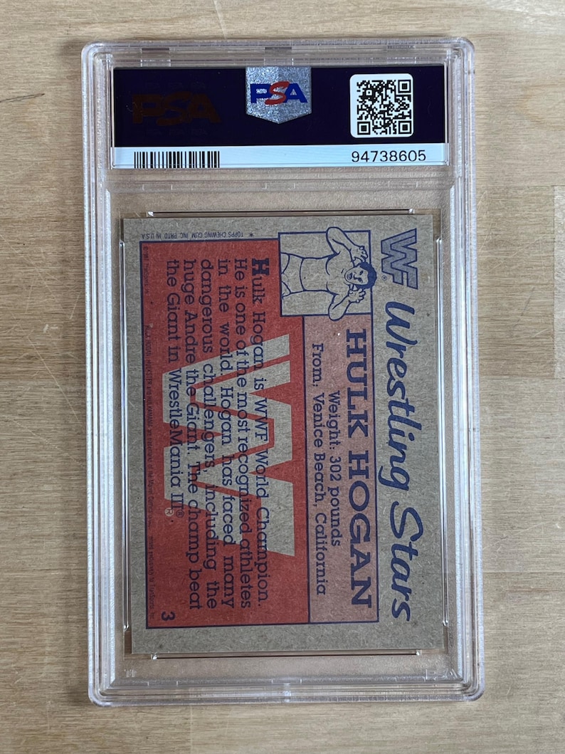 May include: A vintage WWF Wrestling Stars trading card featuring Hulk Hogan, encapsulated in a protective case. The card displays Hogan's image, weight (302 pounds), and location. The text on the card describes Hogan's achievements.