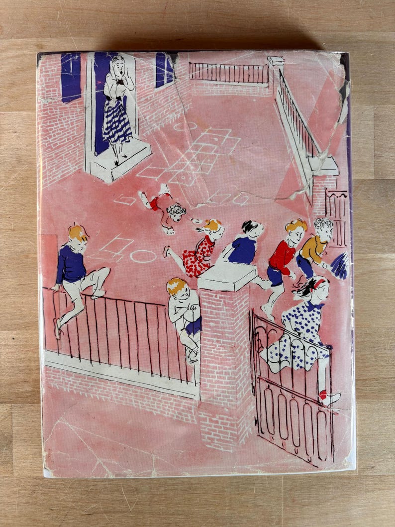 May include: A rectangular book cover featuring a pink-toned illustration of children playing in a courtyard. The scene depicts a person standing in a doorway, children climbing a metal fence, and others running near a gate and hopscotch grid.