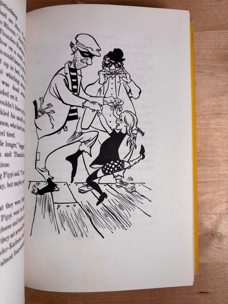 May include: A black and white line art illustration on a book page depicting a tall man in a striped shirt and cap, a man in a hat playing a harmonica, and a young girl with braided hair dancing together on a wooden floor with visible planks.