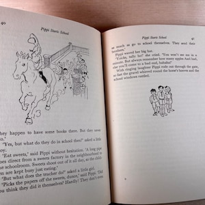 May include: An open book titled Pippi Starts School with pages 40 and 41 visible. The text describes Pippi Longstocking, featuring black and white line illustrations of a person riding a horse and a group of three children standing together.