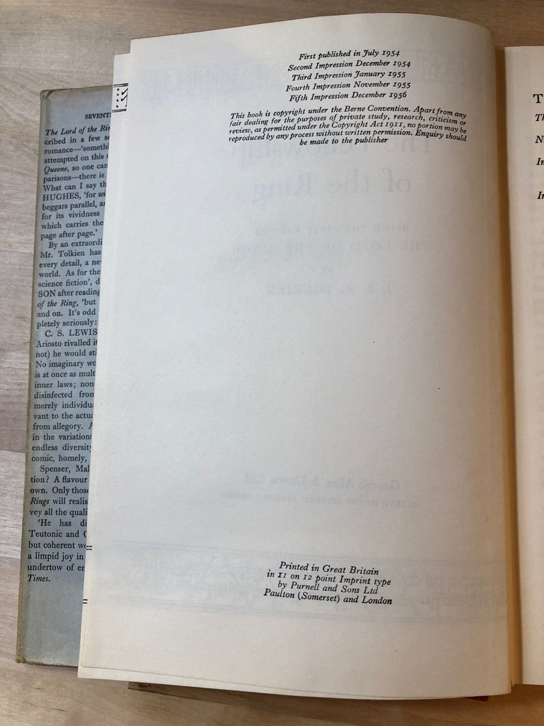 May include: A close-up of a book's copyright page with details about the book's publication history, including the first publication date, subsequent printings, and copyright information. The text includes the title "The Lord of the Rings" and the author's name, J.R.R. Tolkien.
