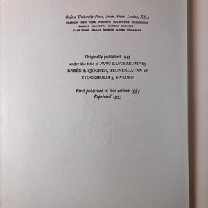 May include: A white book copyright page with black text. It lists Oxford University Press, London, and notes the book was originally published in 1945 as PIPPI LANGSTRUMP by RAB&Eacute;N & SJ&Ouml;GREN, STOCKHOLM, SWEDEN. This edition was published in 1954 and reprinted 1957.