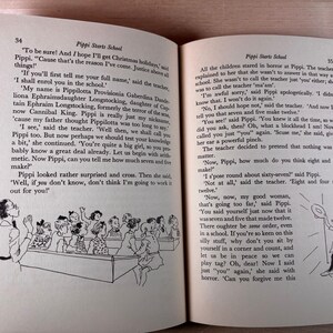 May include: An open book showing pages 34 and 35 of the story Pippi Starts School. The text is printed in black ink on off-white paper. Black and white line art illustrations depict a classroom scene with a teacher and students.