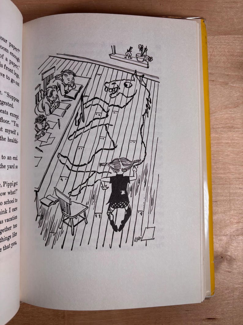 May include: A black and white book illustration showing a classroom scene with a child drawing a large horse outline on the wooden floorboards with a long piece of string. Other children sit at desks nearby, and text is visible on the left page.