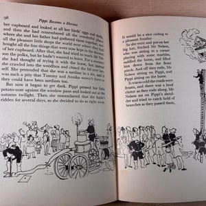 May include: An open book page 98 titled Pippi Becomes a Heroine with black and white illustrations. The text describes Pippi Longstocking's adventures. Below the text, drawings show a vintage fire engine with a hose and a group of people near a tall ladder.