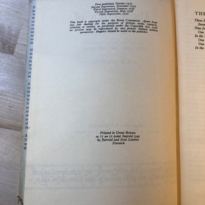 May include: A close-up of a book's copyright page with details about the book's publication history. The text includes the publication dates and the publisher's information. The book is printed in Great Britain by Jarrold and Sons Limited in Norwich.