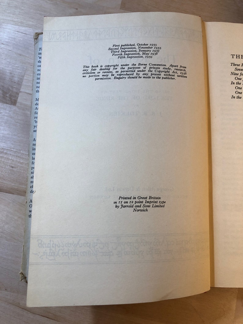 May include: A close-up of a book's copyright page with details about the book's publication history. The text includes the publication dates and the publisher's information. The book is printed in Great Britain by Jarrold and Sons Limited in Norwich.