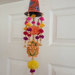 Indian handcrafted wind chimes rajasthani with bells marigold pom poms