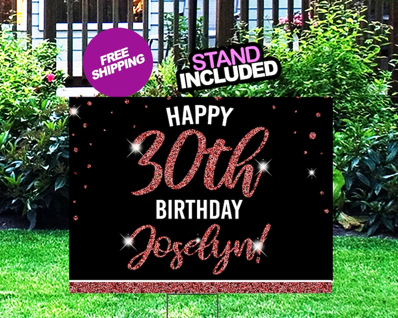 May include: A black and red glitter Happy 30th Birthday yard sign with the name Jocelyn. The sign is on a green lawn with a stand included.