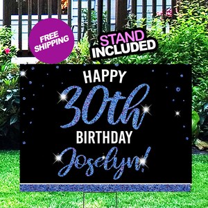 May include: Happy 30th Birthday Jocelyn! Black and blue glitter yard sign with a blue glitter border.