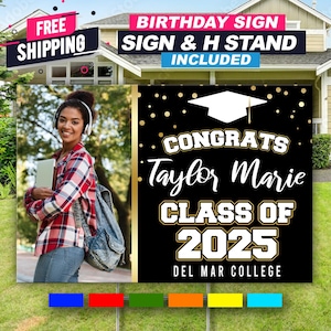 May include: A black and gold graduation sign with a photo of a woman in a plaid shirt. The sign says "Congrats Taylor Marie Class of 2025 Del Mar College".