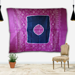 May include: A vibrant purple and navy blue textile with a central square design. The square is filled with white dots and a circular pattern. The textile is decorated with white, curved patterns along the edges. This textile is suitable for home decor.