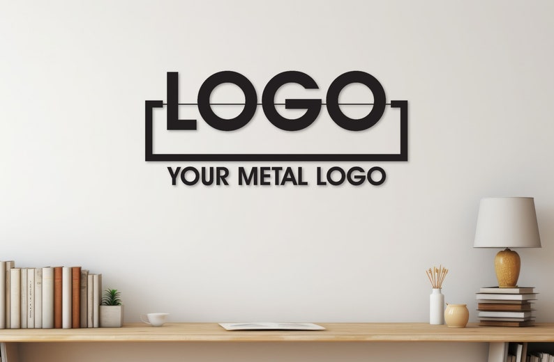 May include: Black metal wall art with the word "LOGO" in a rectangular frame. The text "YOUR METAL LOGO" is below the frame.