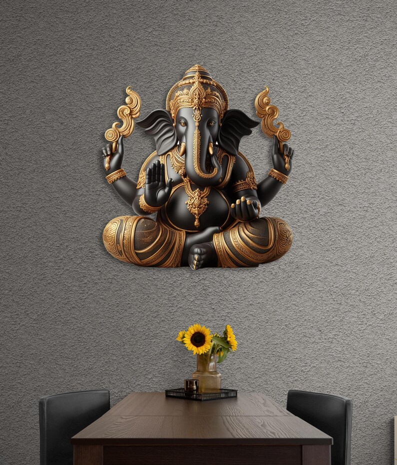 May include: A black and gold Ganesh statue in a seated pose, mounted on a gray textured wall. The statue features intricate details and ornate gold accents. The room includes a dark wooden table with sunflowers in a vase.
