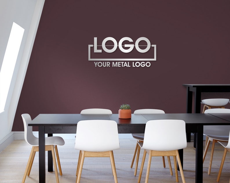 May include: A black table with four white chairs and a metal logo that says "LOGO" with the text "YOUR METAL LOGO" below it. The table is in a room with a burgundy wall and a window.