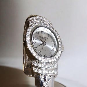 Studio 1 Quartz Silver-Tone Watch with Rhinestone Cuff Bracelet Design (F106)