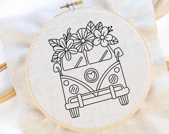 May include: Black and white line drawing of a vintage van with flowers on top. The van has a heart on the front and is in a hoop.