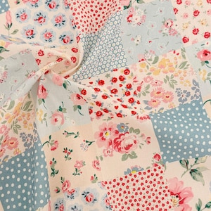 May include: A white ceramic mug with a black handle and the text "But First, Coffee" in a black, handwritten-style font. The mug is on a white surface.