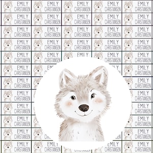 May include: A repeating pattern of labels with the text "EMILY CHRISTIANSEN" and a cartoon wolf illustration. A large, smiling wolf illustration is centered on a white background.