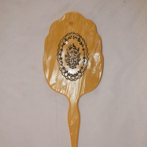 Vintage Celluloid, Bakelite Handmirror with a Floral Design