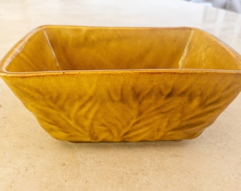 Maceta pequeña vintage de cerámica dorada