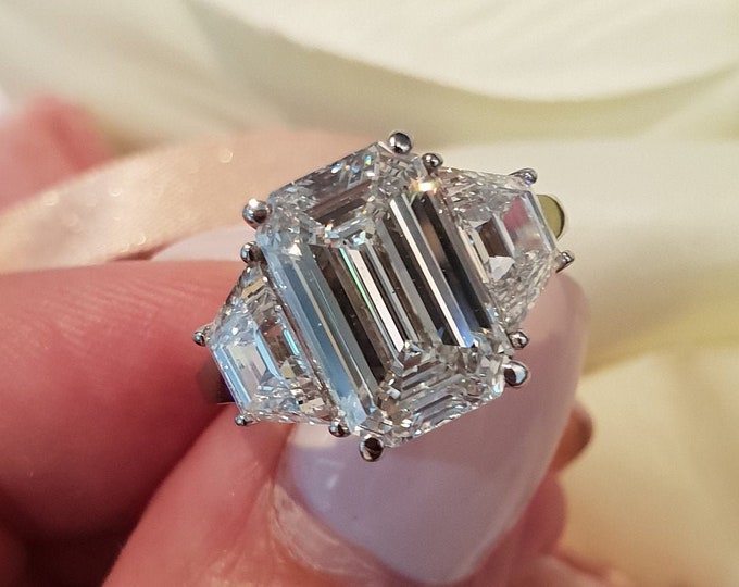 Unique Three Stone Engagement Ring 4.50 Carat IGI Certified Emerald Cut CVD Lab Grown Diamond Set with 1 Carat Trapezoid Side Stones