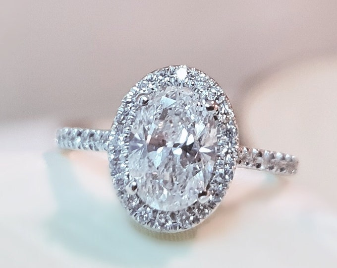This unique vintage style diamond halo setting features a 2 carat IGI certified CVD lab grown diamond and 0.72ct accent diamonds