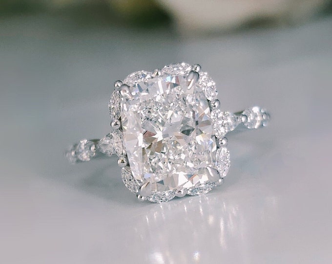 This Victorian style cathedral setting features a unique single prong 0.50 carats diamond halo and is set with a 3 carat center oval cut diamond