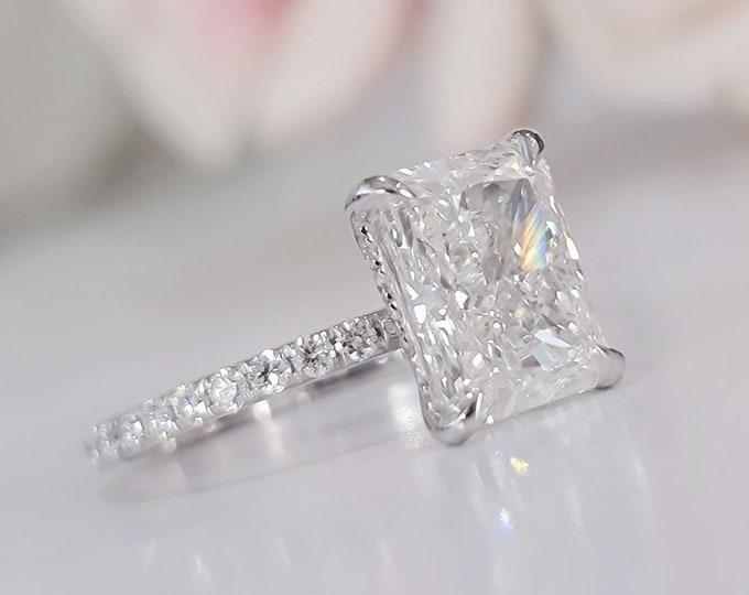 This 14k white gold hidden halo diamond setting features a 3 Carat Radiant Cut IGI Certified CVD lab grown diamond