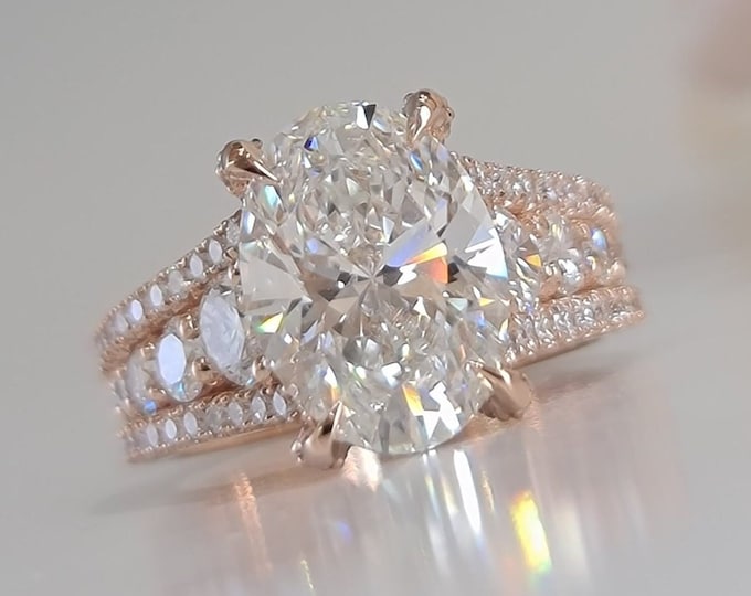 This classic 14K Rose gold setting with hidden halo features a 3ct oval IGI certified CVD lab grown diamond and 0.98ct accent diamonds