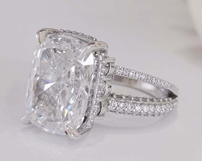 This unique split shank micro pave diamond set band features a 5 carat IGI Certified CVD lab grown cushion cut diamond & 1.30 carats side diamonds