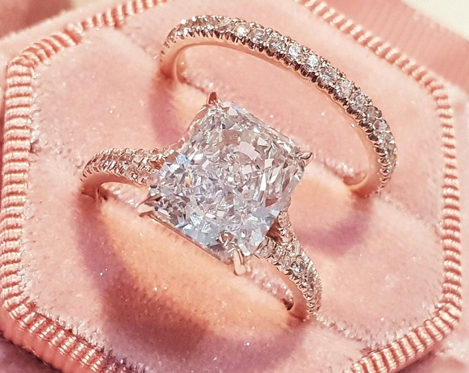 This elegant  14k rose gold split shank diamond setting features a 3 carat radiant cut IGI certified CVD lab grown diamond & 0.67 carats side diamonds accompanied with a matching 0.32cts pave set diamond wedding band