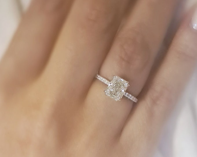 This classic hidden halo pave diamond setting features a 2 carat IGI certified CVD lab grown elongated radiant cut diamond & 0.25 carats accent diamonds