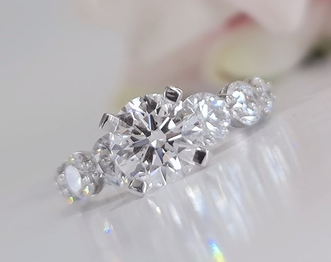 This unique 14K white gold setting features a 2 carat IGI certified CVD lab grown diamond and 1.95 carats side diamonds
