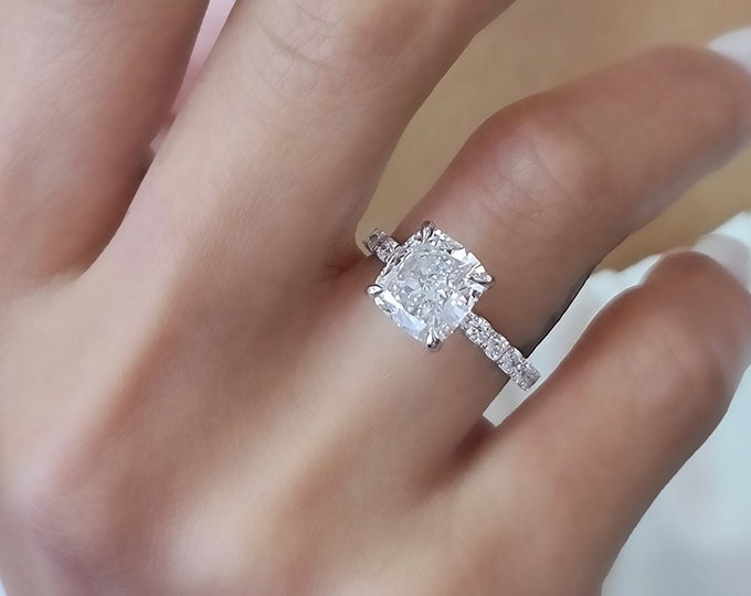 This classic 14K Gold  pave diamond setting features a 3 carat IGI certified CVD lab grown cushion cut diamond & 0.56 carats accent diamonds