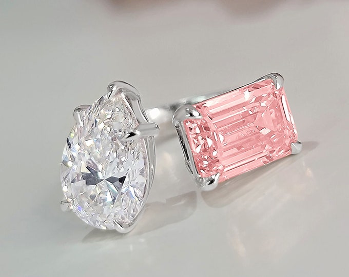 This stunning unique Toi Et Moi Ring features a 3 carat teardrop & 3 carat emerald cut  pink IGI certified CVD lab grown diamonds