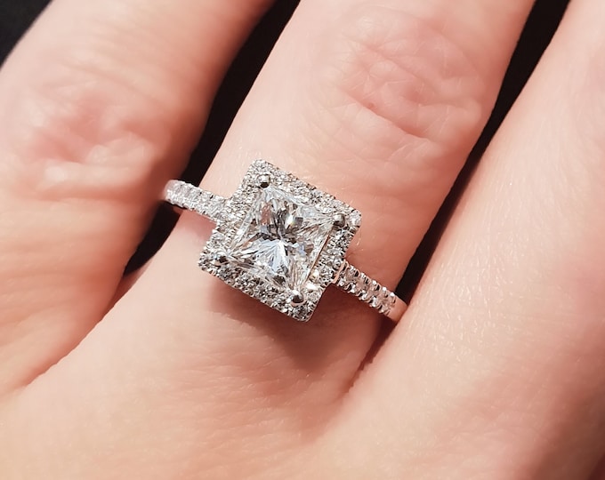 This classic halo 14K white gold pave diamond setting features a 2 carat IGI certified CVD lab grown diamond and 0.35ct side diamonds