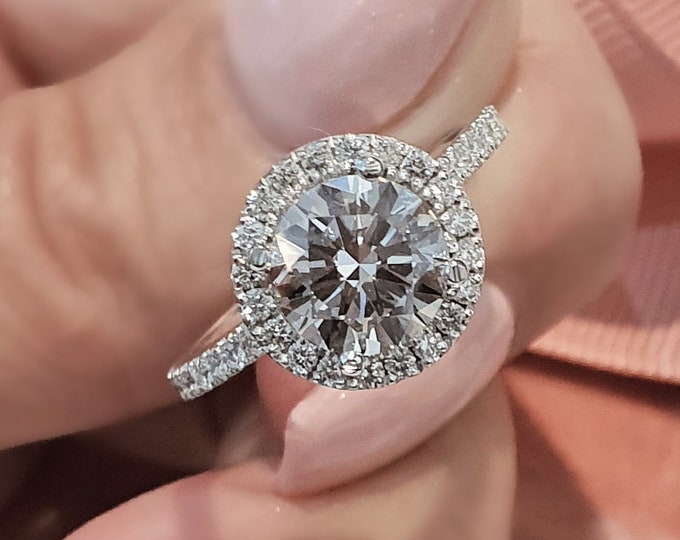 This unique Diamond halo pave setting features a 2 Carat Round Cut IGI certified CVD lab grown diamond