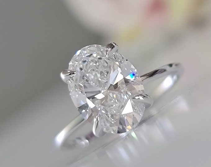 This Classic 14k hidden halo setting features a 2.50 carat IGI Certified CVD lab Grown diamond & 0.60ct accent diamonds