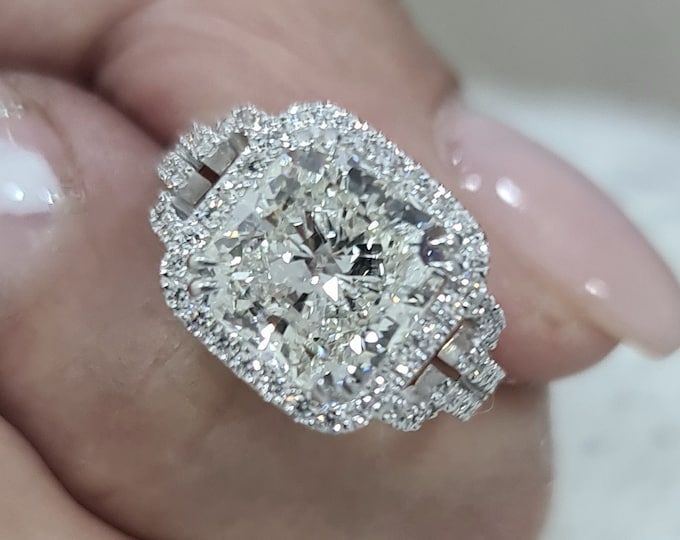 This unique split shank with pave diamond & halo setting features a 3 Carat Cushion Cut IGI Certified CVD lab grown diamond