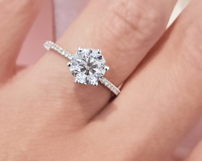 This Classic hidden halo pave diamond setting features a 1 carat Round Cut IGI Certified CVD Lab Grown Diamond & 0.30 carats accent diamonds
